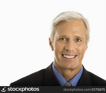 Middle aged Caucasian man in business suit smiling at viewer.