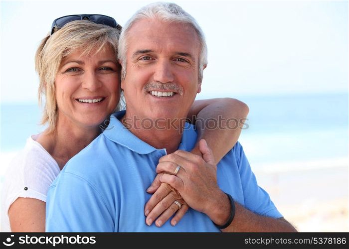 Middle-aged couple at the coast