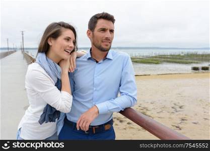 middle-aged couple enjoying the coastal view