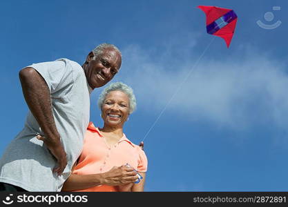 Middle-Aged Couple Flying Kite