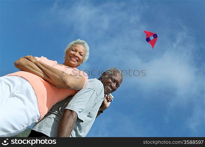 Middle-Aged Couple Flying Kite