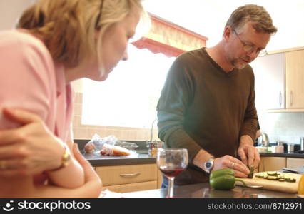 middle aged couple in kitchen