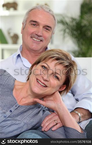 Middle-aged couple sat together