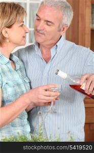 Middle-aged couple with wine