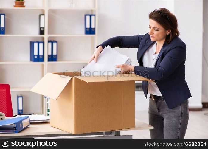 Middle-aged female employee being fired from her work 