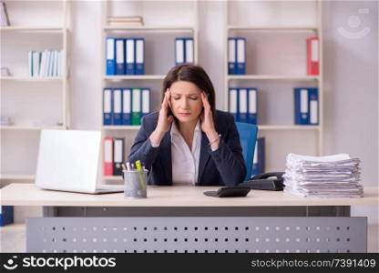 Middle-aged female employee suffering in the office 