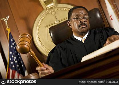 Middle-aged judge forming sentence