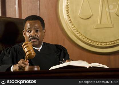 Middle-aged judge holding gavel