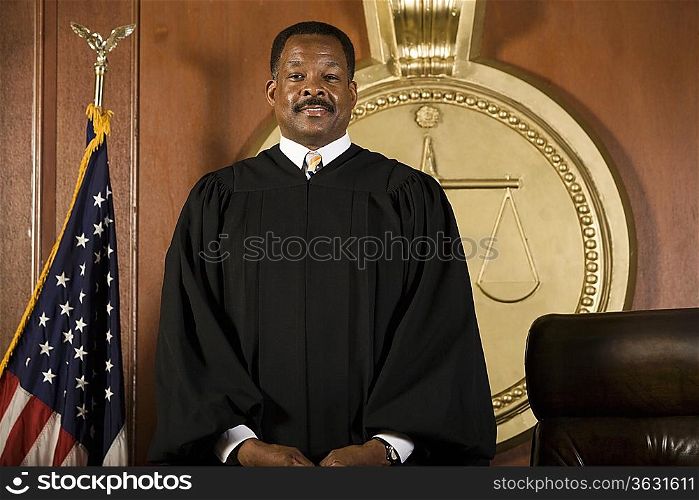 Middle-aged judge standing in a courtroom
