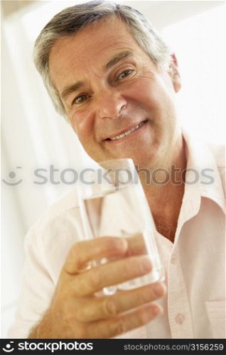 Middle Aged Man Drinking A Glass Of Water