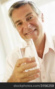 Middle Aged Man Drinking A Glass Of Water