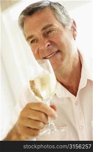 Middle Aged Man Drinking A Glass Of Wine