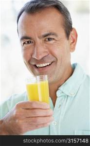 Middle Aged Man Drinking Fresh Orange Juice