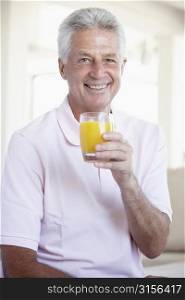 Middle Aged Man Drinking Orange Juice