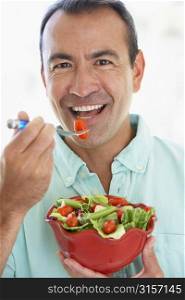 Middle Aged Man Eating A Fresh Green Salad
