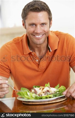 Middle Aged Man Eating A Healthy Meal