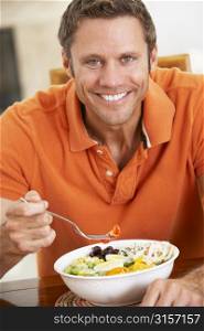 Middle Aged Man Eating A Healthy Meal, Smiling At The Camera