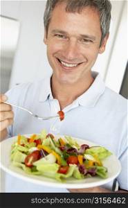 Middle Aged Man Eating A Healthy Salad