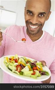 Middle Aged Man Eating A Salad