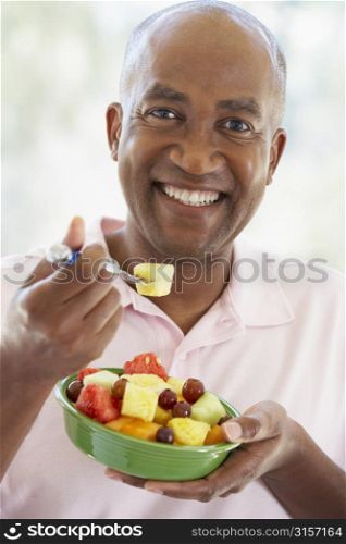 Middle Aged Man Eating Fresh Fruit Salad
