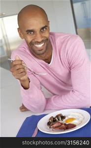 Middle Aged Man Eating Unhealthy Fried Breakfast
