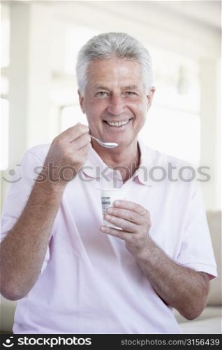 Middle Aged Man Eating Yogurt
