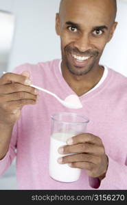 Middle Aged Man Holding Dietary Supplements