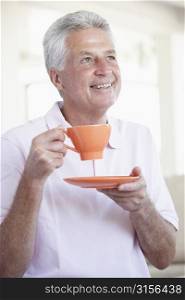 Middle Aged Man Holding Orange Mug