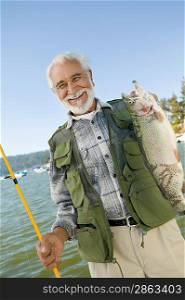 Middle-Aged Man Holding Up Trout