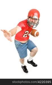 Middle aged man in his high school football jersey and helmet, reliving his past. Isolated on white.