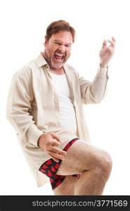 Middle-aged man rocks out playing air guitar in his underwear. Isolated on white.