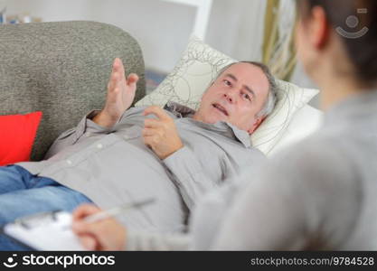 middle aged man talking to therapist