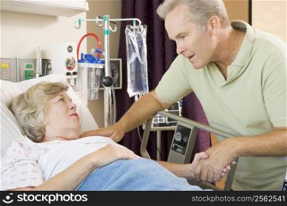 Middle Aged Man Visiting His Mother In Hospital