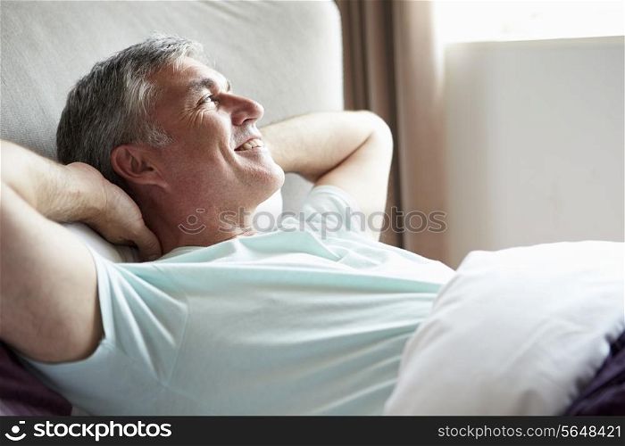 Middle Aged Man Waking Up In Bed