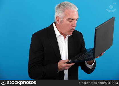 middle-aged man with laptop