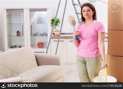 Middle-aged woman doing renovation at home 