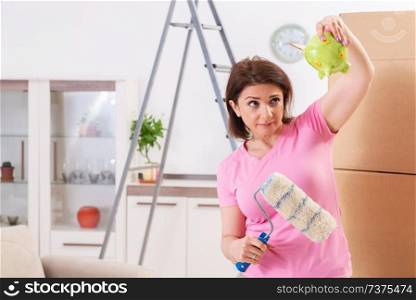Middle-aged woman doing renovation at home 