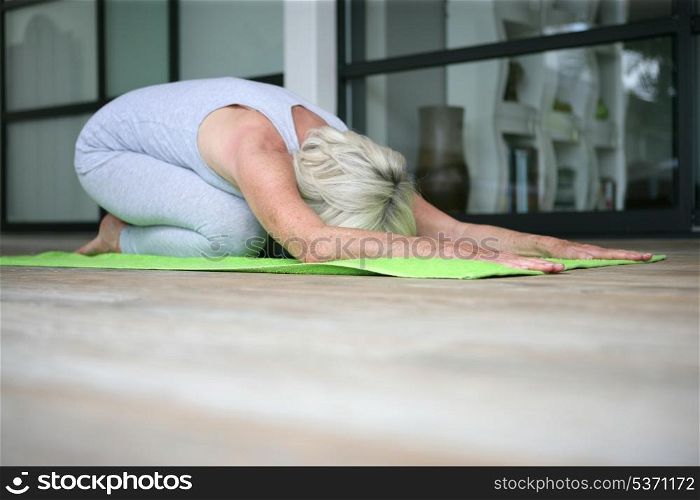 Middle-aged woman doing yoga