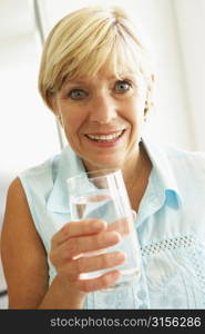 Middle Aged Woman Drinking A Glass Of Water