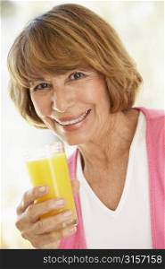 Middle Aged Woman Drinking Fresh Orange Juice