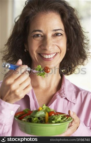 Middle Aged Woman Eating A Salad