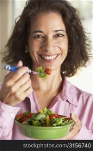 Middle Aged Woman Eating A Salad