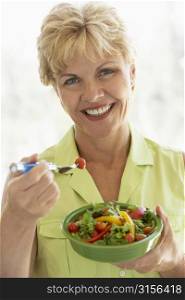 Middle Aged Woman Eating Fresh Salad