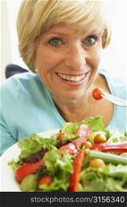 Middle Aged Woman Eating Healthy Salad
