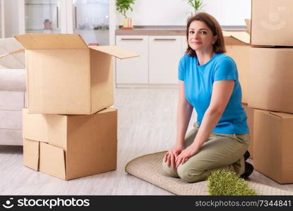 Middle-aged woman moving to new flat 