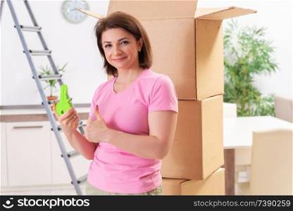 Middle-aged woman moving to new flat