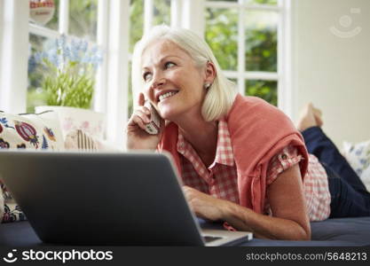 Middle Aged Woman Ordering Item On Telephone