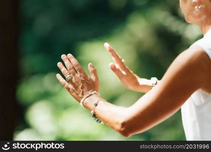 Middle Aged Woman Practicing Tai Chi Chuan in the Park. Close Up On Hands Position