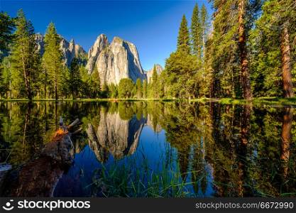 Middle Cathedral Rock reflecting in Merced River at Yosemite. Middle Cathedral Rock reflecting in Merced River at Yosemite National Park. California, USA.