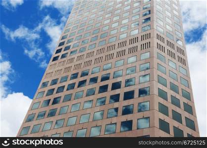 middle part of a modern skyscraper against blue sky